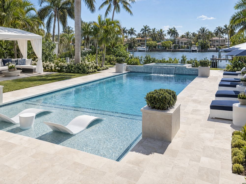 Paver patio and outdoor living space by the pool